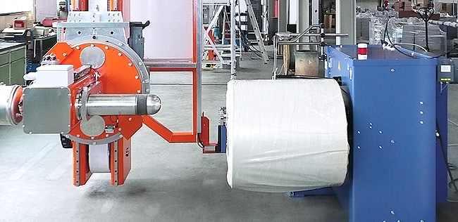 SAHM PAN Precursor Winder in combination with an automatic bobbin handling and transport system SAHM PAN Precursor Winder in combination with an automatic bobbin handling and transport system